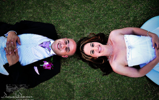 Newly Wed couple, lie on the grass